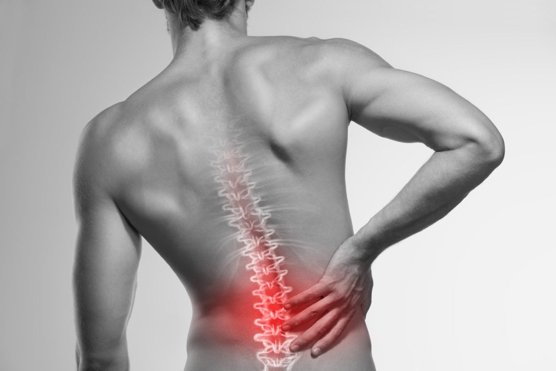 view of male back with spine graphic indicating pain