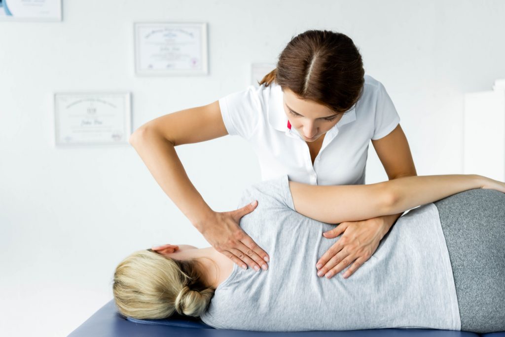 female chiropractor giving treatment